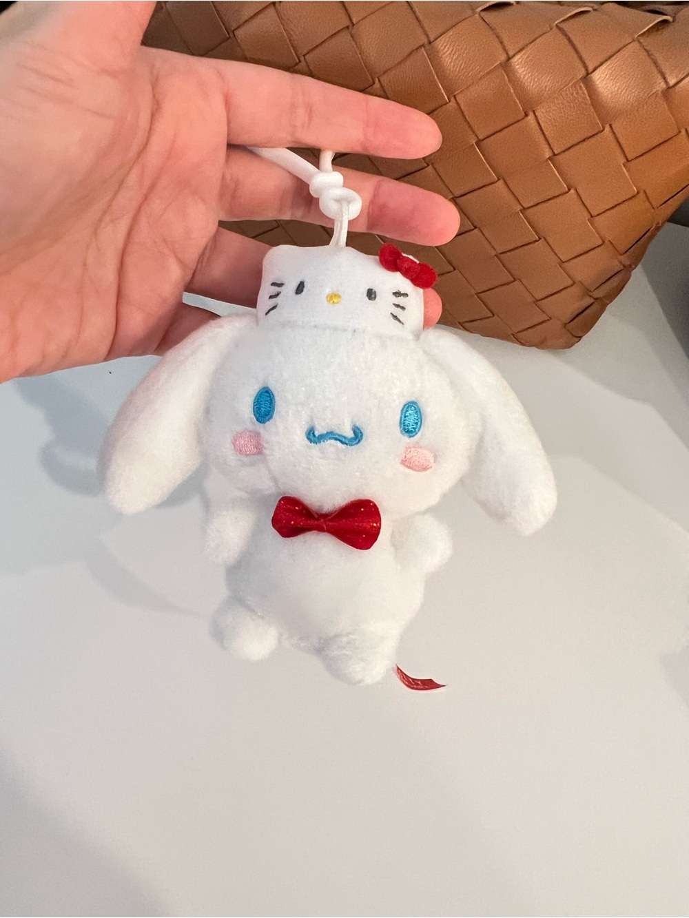 Sanrio White Cinnamoroll Plush Keychain with Red Bow and Blue Eyes